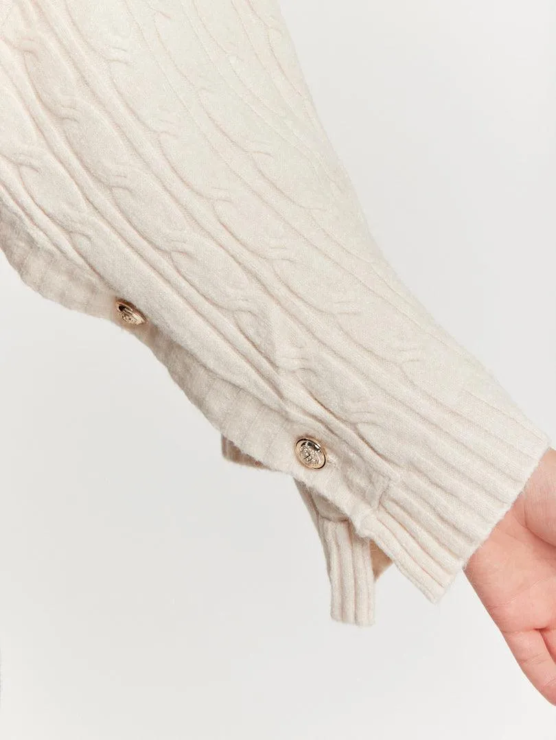 Pull crop top col roulé